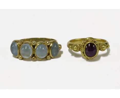 A 9ct gold four stone cabochon aquamarine ring, and a gold cabochon Roman style ruby ringruby 6.38gaquamarine 4.48g