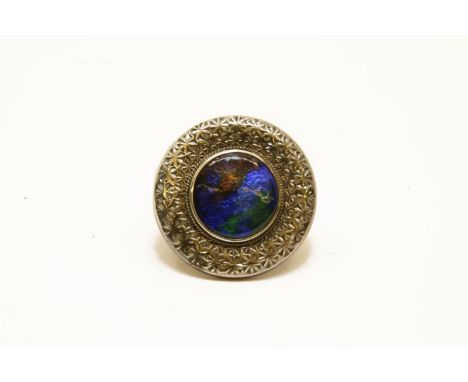 A Charles Horner silver enamel brooch, central circular blue, green and brown enamel plaque, rub set to a worked border, Ches