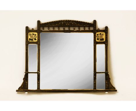 An Aesthetic Movement style mirror with ebonised and gilded frame