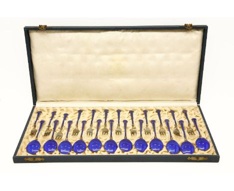 A cased set of enamel and silver gilt dessert forks and spoons