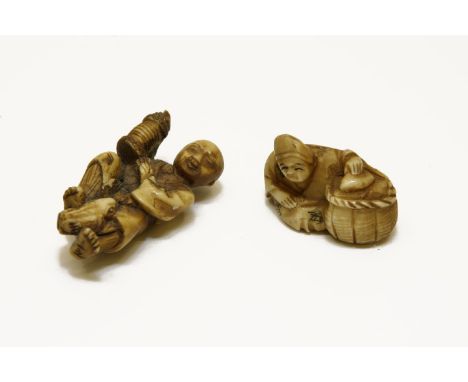 Two Japanese ivory netsuke,  a man and frog, and a seated man by a basket, one signed, late 19th century