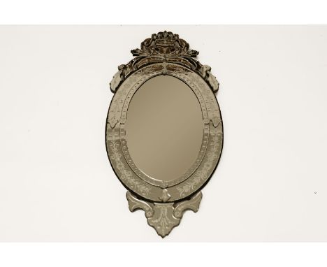 A large Venetian style wall mirror, with pierced crest, 140 x 65cm