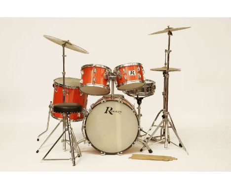 Rogers red lacquered drum kit, fitted with pearl and cymbals