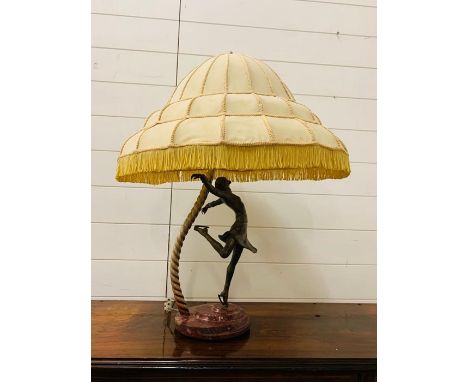 An Art Deco Lamp, featuring a female skater on a marble base, under an impressive Art Deco shade. (70 cm H x 50 cm W)