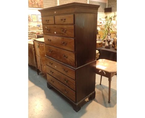 Georgian walnut chest on chest with brass handles on bracket feet
