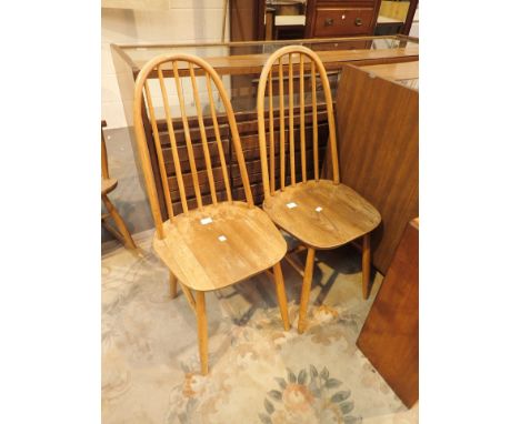 Pair of light wood Ercol stickback dining chairs