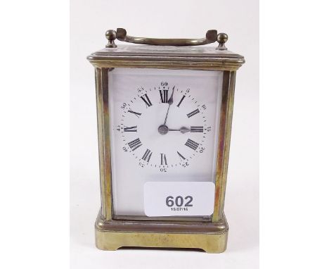 A brass cased carriage clock and key