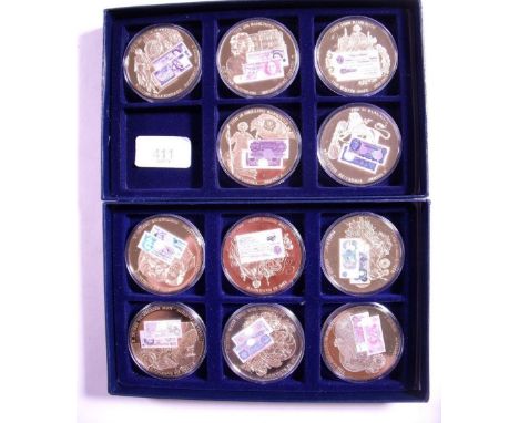 (2) Windsor Mint presentation boxes containing banknote commemorative coins of Britain, coins 11 total gold plated with bank 