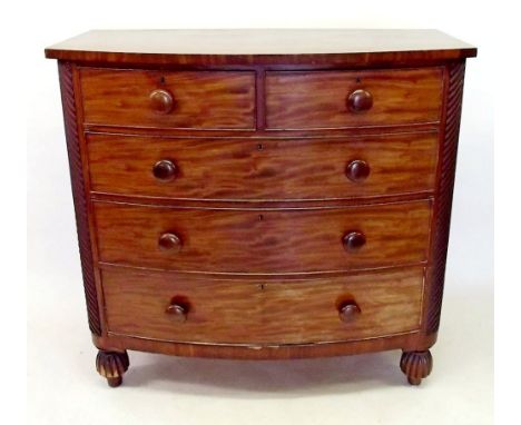 A Victorian mahogany bow fronted chest of two short and three long drawers on reeded feet