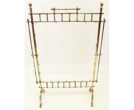 A late Victorian brass spindle decorated firescreen with mounting hooks for tapestry panel