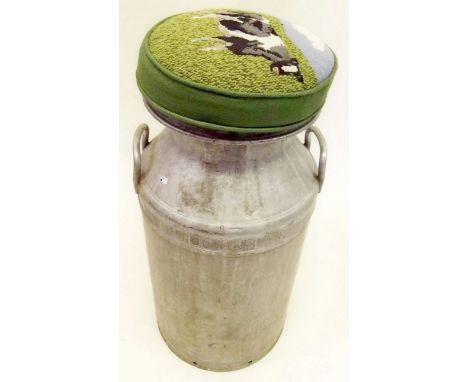 An old milk churn with tapestry cover to lid