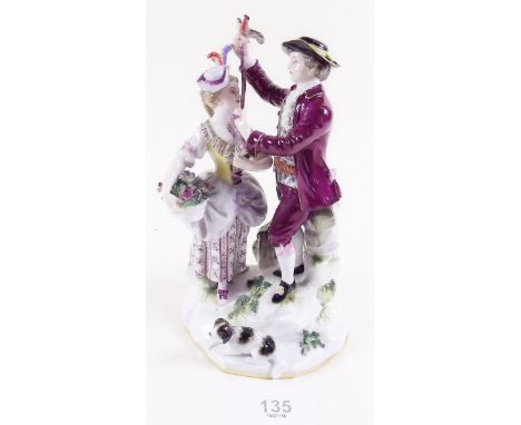 A late 19th century Meissen group of a lady and gentleman with bird on a ribbon and a dog to the base, 17cm tall, Condition -