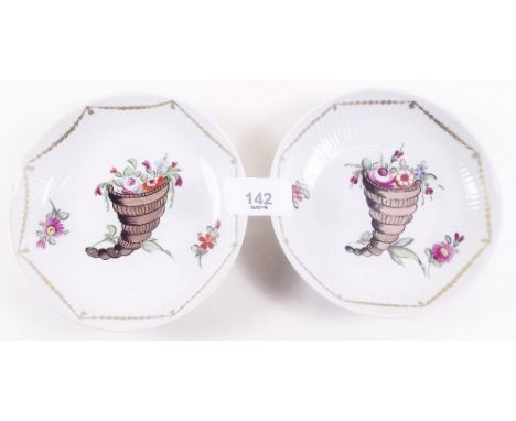 A pair of rare 18th century Italian porcelain saucers painted cornucopia, with double 'V' monogram for Vische, Turin