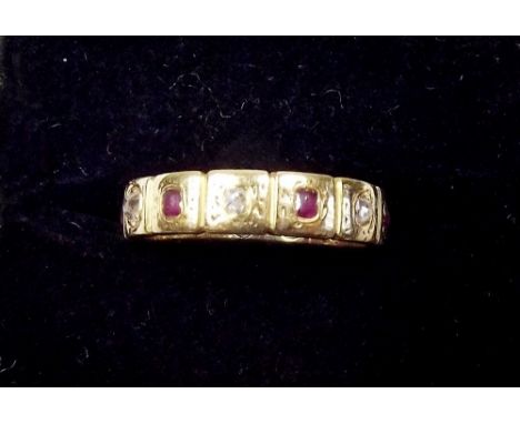 A gold ruby and diamond set eternity ring 