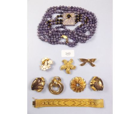 A box of costume jewellery, including a Napier silver gilt bow brooch, Monet etc