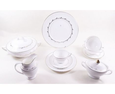 A Royal Doulton Rondo dinner service comprising:- seven dinner plates, six side plates, six tea plates, six soup bowls, two t