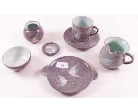 A group of Studio pottery by Fishley Holland decorated birds, monogram FH, comprising two cups and saucers, two jugs, sugar, 