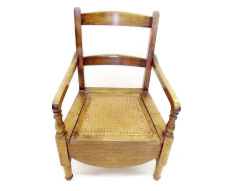 A Victorian commode chair with cane seat
