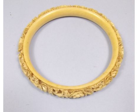 A Victorian ivory floral carved slave bangle