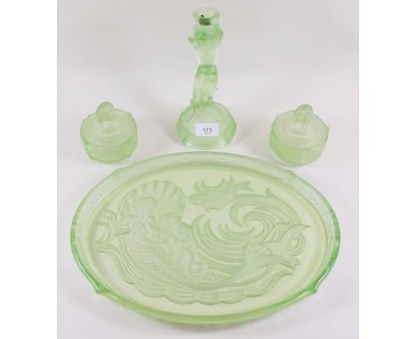 An early 20th century green glass dressing table set with tray, candlestick and two boxes moulded mermaids