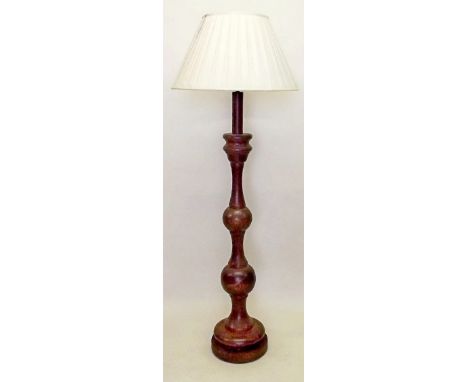 A turned wood standard lamp and shade