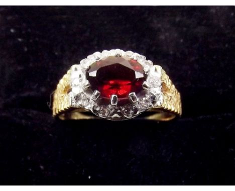 An 18 carat gold ruby and diamond ring 