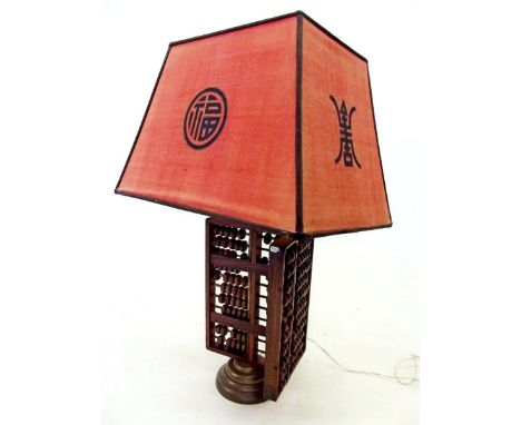 A Chinese abacus table lamp with shade