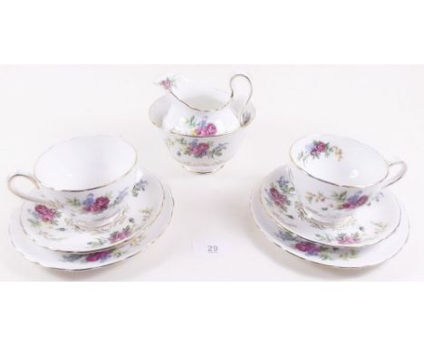 A Royal Chelsea floral tea service comprising twelve cups and saucers, cake plate, six plates, milk and sugar