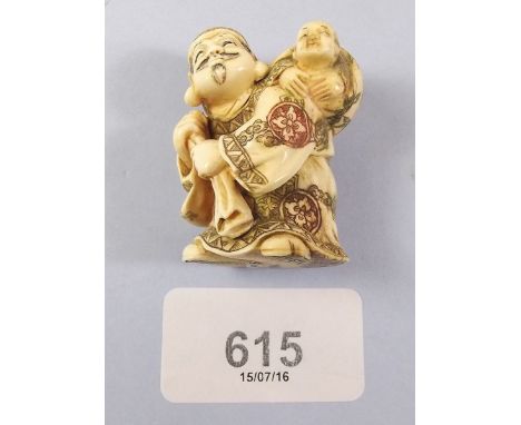 A Japanese Meiji period ivory netsuke of man carrying a baby on his back - signed