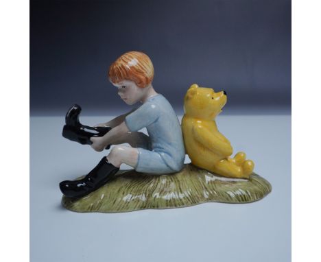 Royal Doulton presents Christopher Robin and Pooh from The Winnie the Pooh Collection, a beautifully crafted porcelain figuri