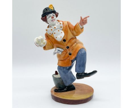 This charming Royal Doulton porcelain figurine, titled "The Clown," showcases an animated and whimsical figure dressed in a v