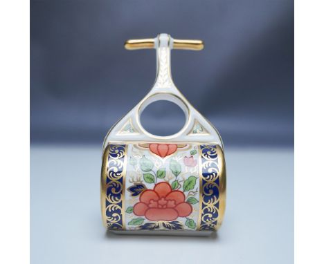 This exquisite Royal Crown Derby Mini Garden Roller figurine showcases the intricate Lotus Blossom pattern, adorned with vibr