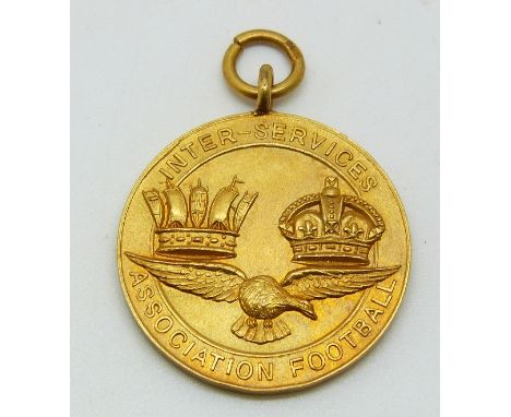 A 9ct gold Inter-service Association Football medal with eagle below two crowns, engraved verso 1932-33 Royal Navy and Royal 