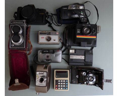Cameras to include Photoina Reflex TLR, Polaroid, Kodak disc camera, Colorshot Specto 88 cine camera, vintage CBM calculator 