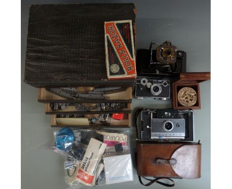 Vintage cameras including folding Kodak, Polaroid and Argus rangefinder, cased compass, accessory drawer unit with model trai