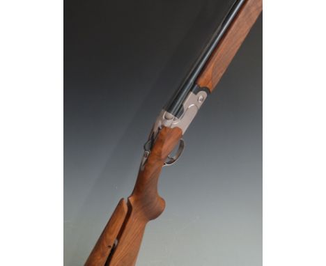 Cased Beretta 692 12 bore over and under ejector shotgun with named matt locks, chequered semi-pistol grip and forend, adjust