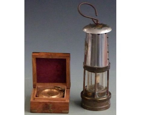 Miner's lamp and cased compass
