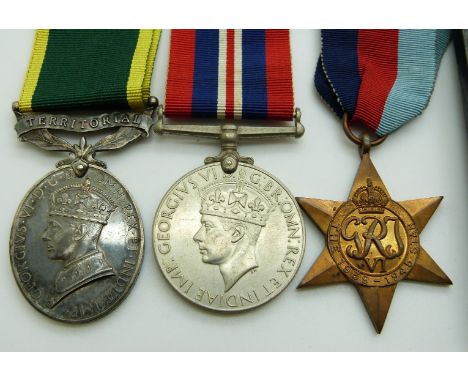 British Army WWII medals comprising 1939/1945 Star, War Medal and Territorial&nbsp;Efficiency Medal named to 76976 Driver J M