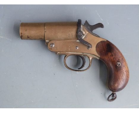 Cogswell and Harrison of London brass flare pistol with named frame stamped with crown over GR cypher, shaped wooden grips, b