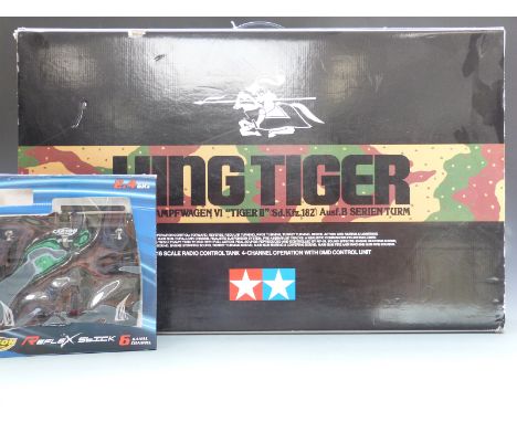 Tamiya 1:16 scale radio control King Tiger German Heavy Infantry Tank Type VI 56018 together with a Carson Model Sport Reflex