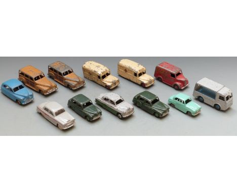 Twelve Dinky Toys diecast model vehicles including ambulances, Dunlop Trojan van, N.C.B Electric Van, Vanguard, Austin A30 et