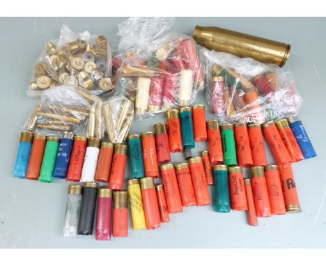 Fifteen collectable shotgun cartridges together with a collection of shotgun and rifle cartridge cases including a 30mm brass