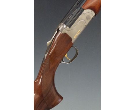Classic Sporting 12 bore over and under shotgun with named locks, chequered semi-pistol grip and forend, vented top and centr