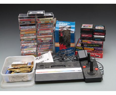 Atari 2600 video games console together with 47 various Atari and Commodore games and cartridges, Super-Deluxe Competition Jo