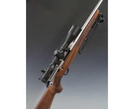 Tikka T3 .243 bolt action rifle with chequered semi-pistol grip and forend, folding bi-pod, sling mounts, Hawke Endurance 4-1