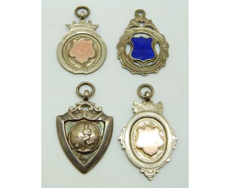 Four hallmarked silver football or similar sporting interest medals, one with enamel shield to front engraved verso DSFA 1913