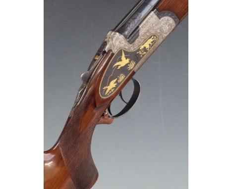 Arizaga 12 bore over and under sidelock shotgun with gilt engraved scenes of dogs and birds to the locks, engraved underside,