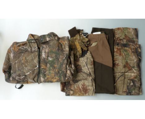 A collection of shooting/ fishing related clothing including RedHead relaxed fir Briar jeans new with tags, two pairs of trou