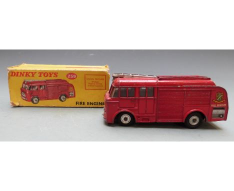 Dinky Toys diecast model Fire Engine with red body, windows, fingertip steering and four-wheel suspension, 259, in original b