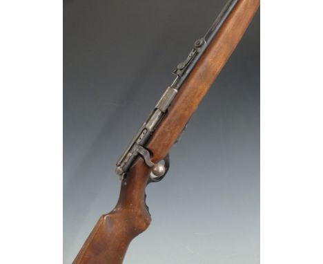Mossberg .22 bolt action rifle with semi-pistol grip, adjustable sights and 23 inch barrel stamped 'United States Property', 